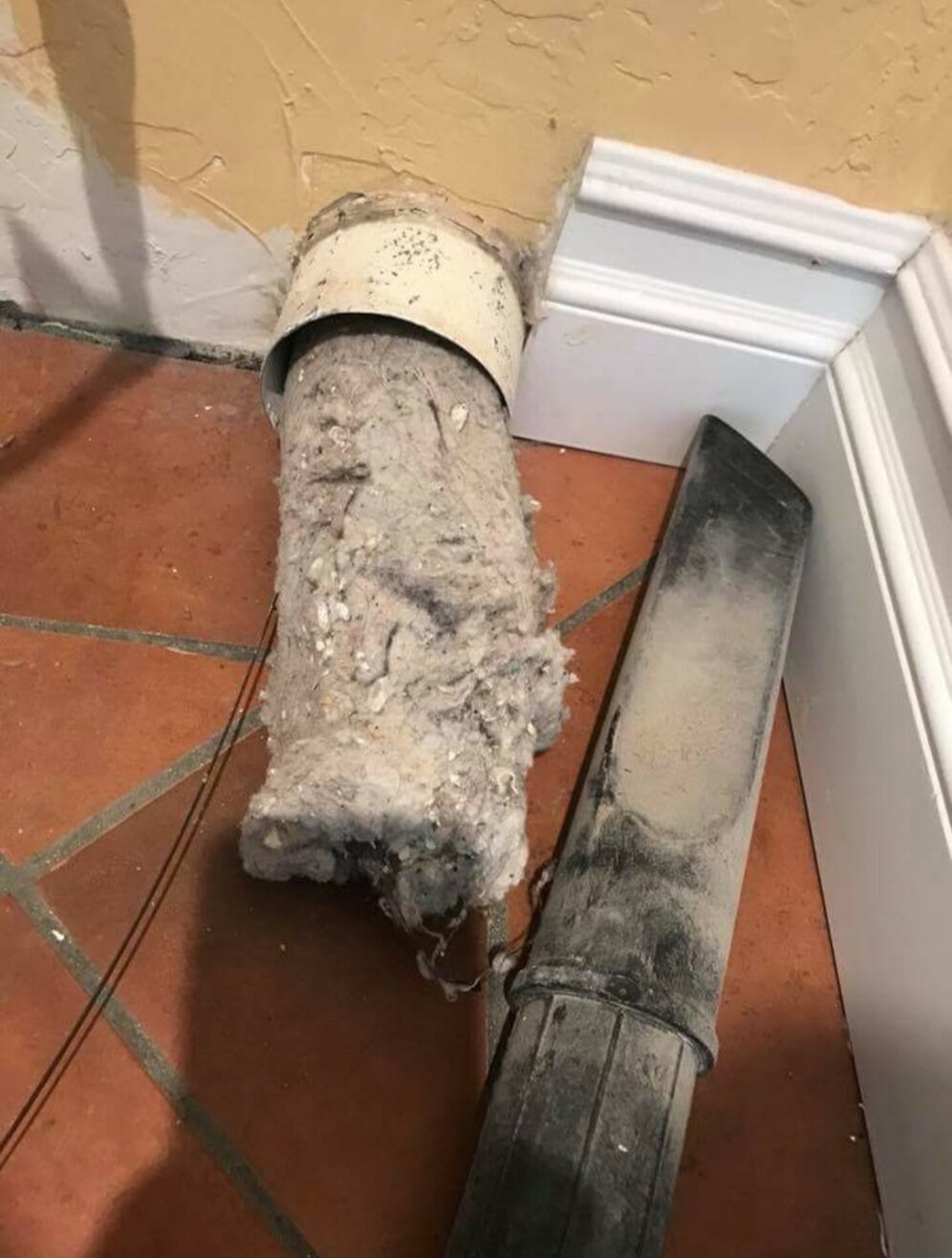 A solid tube of lint pulled out of one dryer vent line